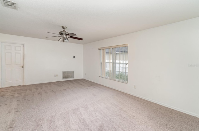 unfurnished room with ceiling fan and carpet floors