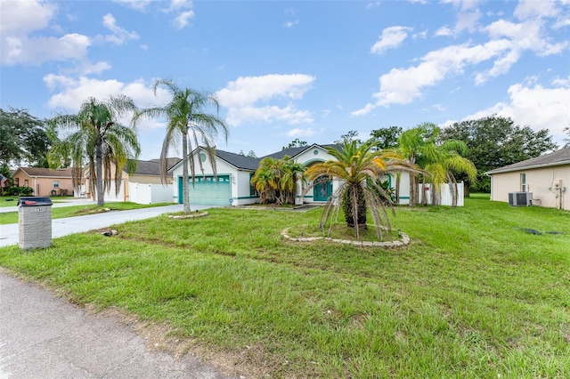 single story home with central AC, a front yard, and a garage