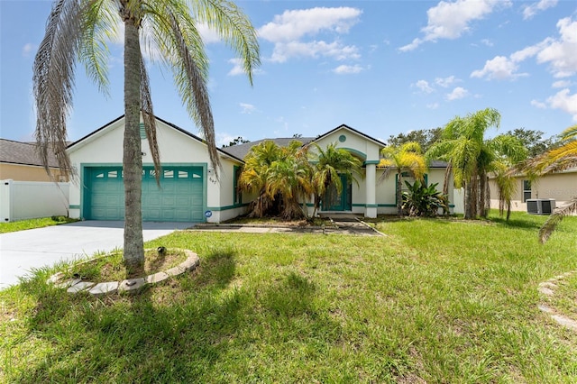 view of front facade featuring a garage, central AC, and a front lawn