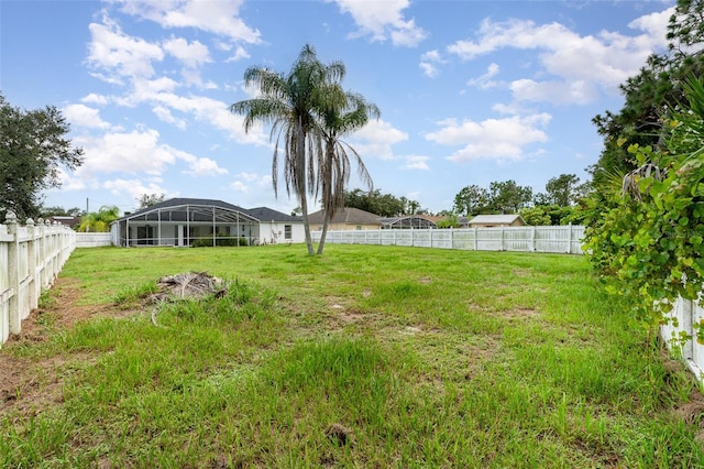 view of yard featuring glass enclosure