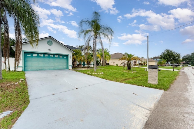 view of front facade featuring a front yard and a garage