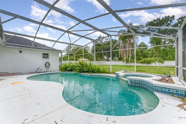 view of swimming pool with a lanai, an in ground hot tub, and a patio area