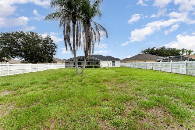 view of yard with a lanai