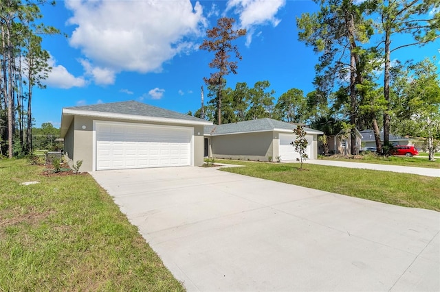 ranch-style home featuring a garage and a front yard