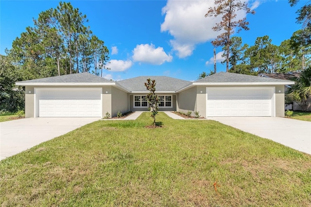 ranch-style home featuring a garage and a front lawn