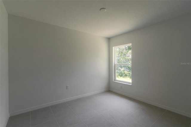 view of tiled spare room