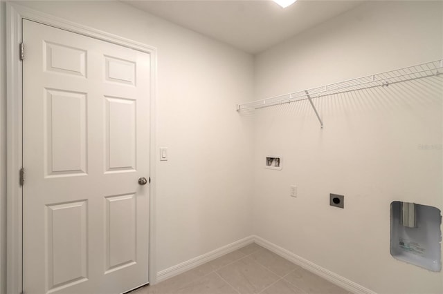 laundry room with hookup for an electric dryer, washer hookup, and light tile patterned floors