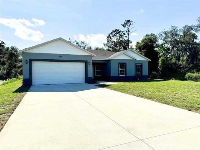 ranch-style home with a garage and a front lawn