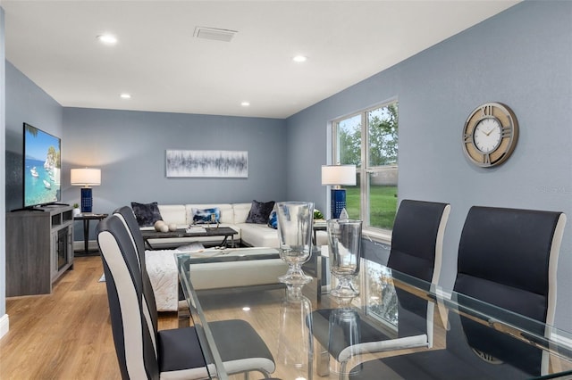 dining space featuring light wood-type flooring