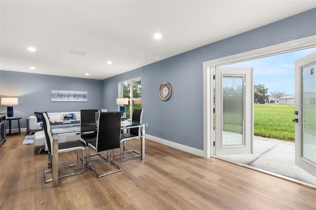 dining space featuring light wood-type flooring