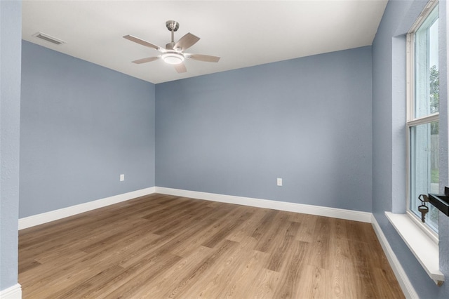 unfurnished room with ceiling fan and light hardwood / wood-style floors