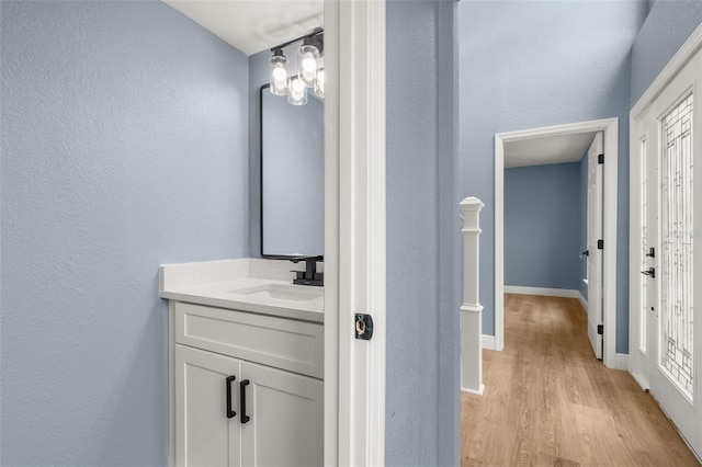 bathroom featuring vanity and hardwood / wood-style flooring