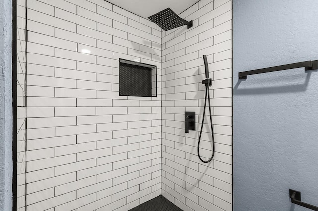 bathroom featuring tiled shower