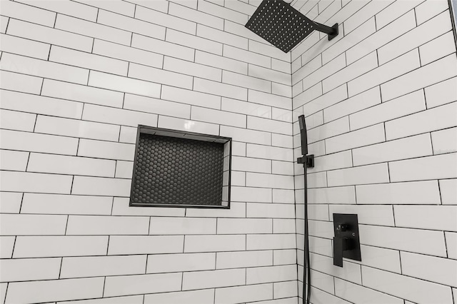 bathroom with tiled shower