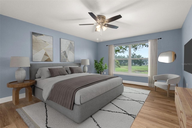 bedroom featuring ceiling fan and hardwood / wood-style floors