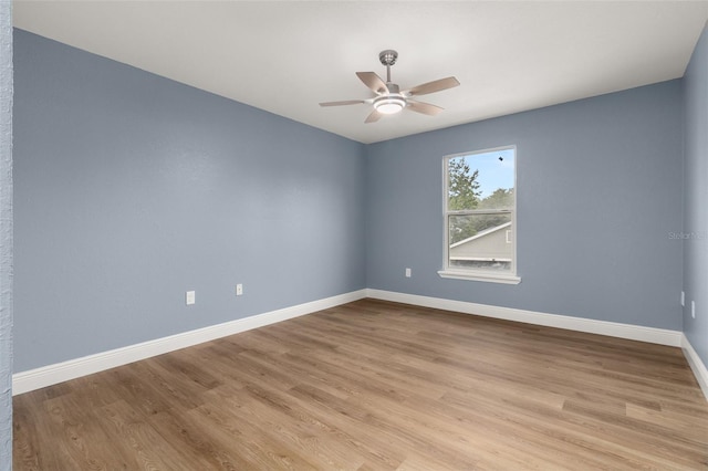 unfurnished room featuring ceiling fan and light hardwood / wood-style flooring