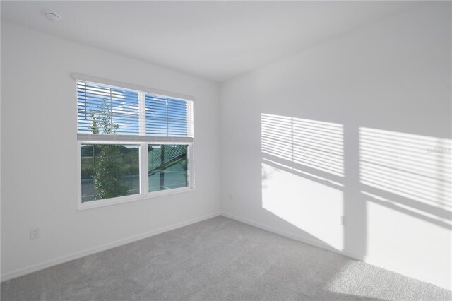 unfurnished room with carpet floors