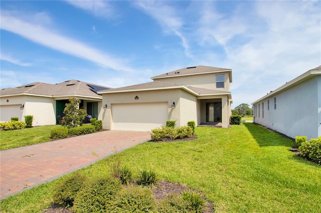 view of front of property with a front lawn and a garage