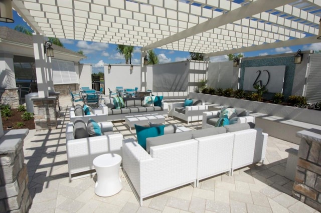 view of patio / terrace with a pergola and an outdoor hangout area