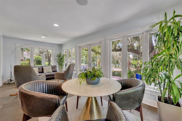 sunroom / solarium featuring french doors