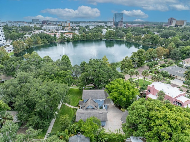 drone / aerial view featuring a water view and a view of city