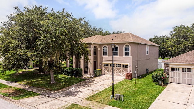 view of front of home featuring a garage and a front yard