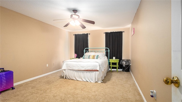 bedroom featuring light carpet and ceiling fan