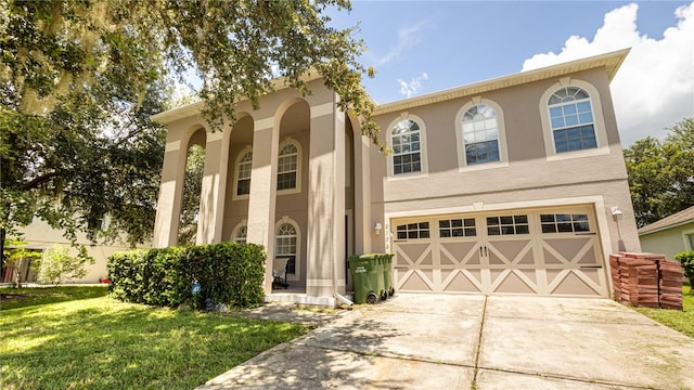 view of front of property featuring a garage and a front yard