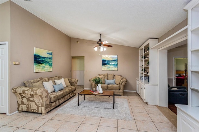 living room featuring ceiling fan, a textured ceiling, lofted ceiling, and light tile patterned floors