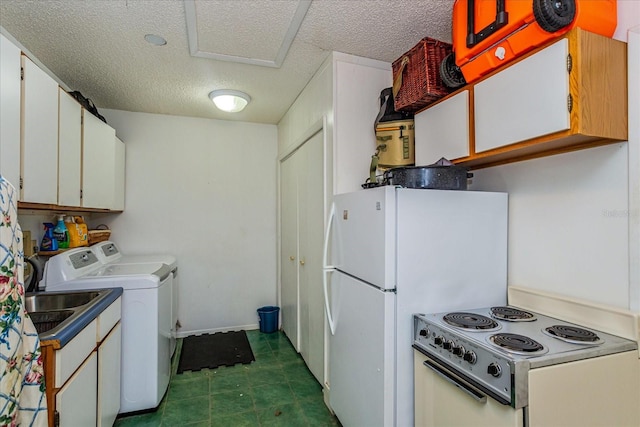 kitchen with white refrigerator, washing machine and clothes dryer, a textured ceiling, white cabinetry, and range with electric stovetop