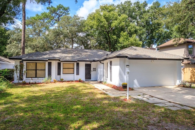 ranch-style home with a garage and a front yard