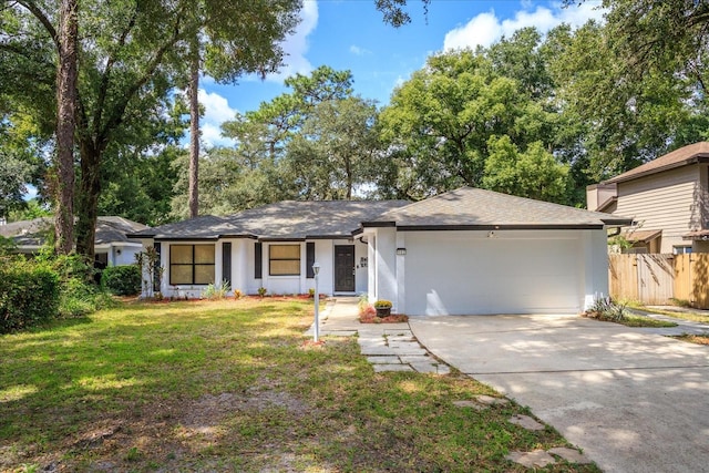 ranch-style home featuring a front yard and a garage