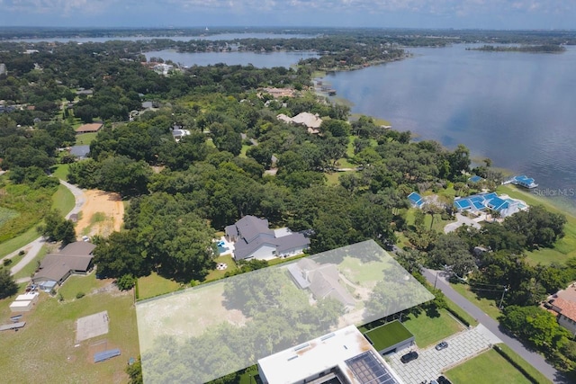 drone / aerial view with a water view