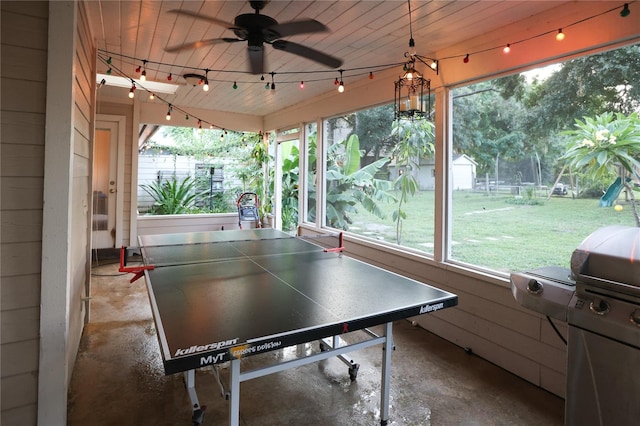 game room featuring wood ceiling, ceiling fan, concrete floors, and track lighting