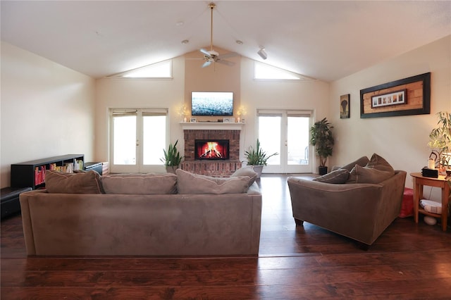 living room with plenty of natural light, dark hardwood / wood-style floors, and french doors