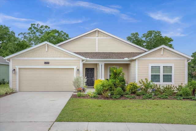 view of front facade with a garage, a front lawn, concrete driveway, and roof with shingles