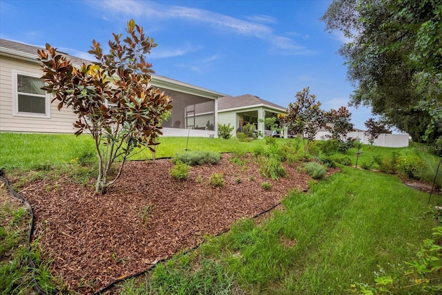 view of yard with a sunroom