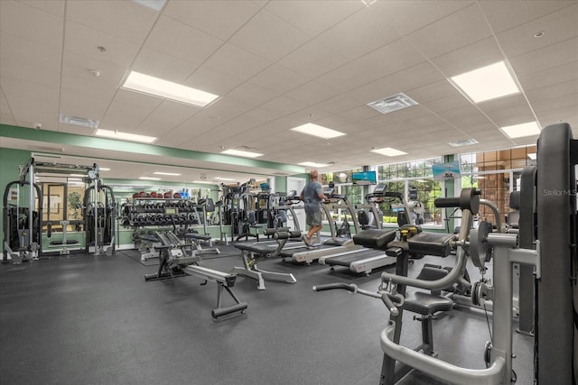 workout area featuring a drop ceiling and visible vents