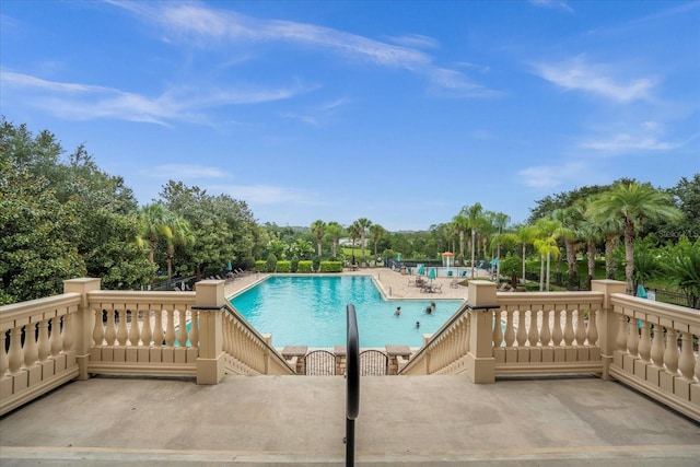 community pool featuring a patio area