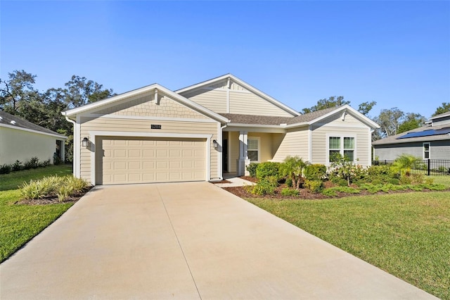 view of front of property featuring a garage, concrete driveway, and a front yard