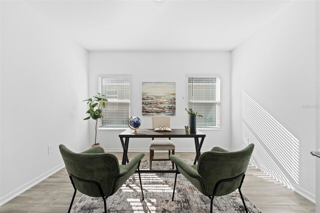 office space with baseboards and wood tiled floor