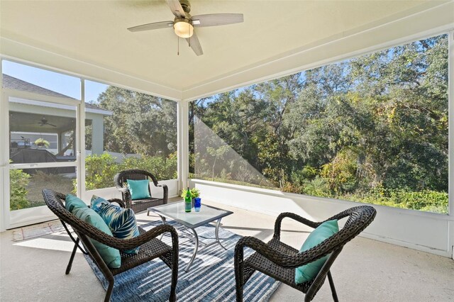 sunroom featuring ceiling fan