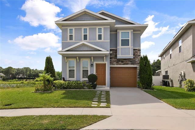 view of front of property with a garage and a front yard