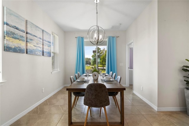 dining area with light tile patterned flooring and a notable chandelier