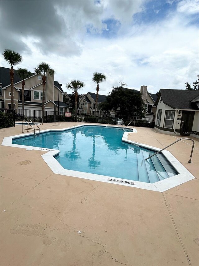 view of swimming pool with a patio area