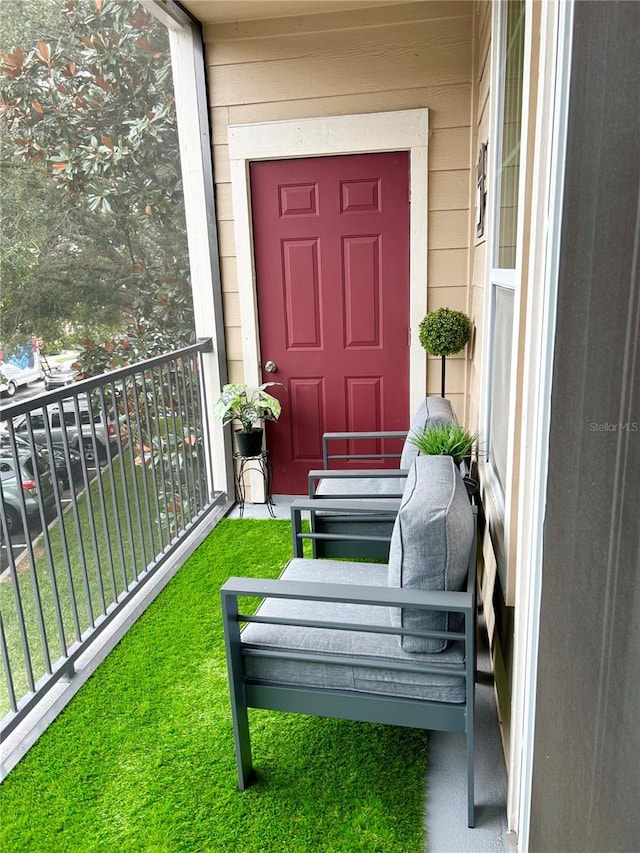 entrance to property featuring a balcony