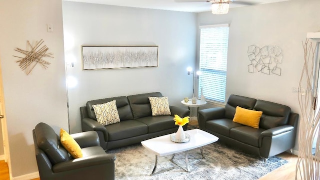 living room with ceiling fan, hardwood / wood-style flooring, and a healthy amount of sunlight