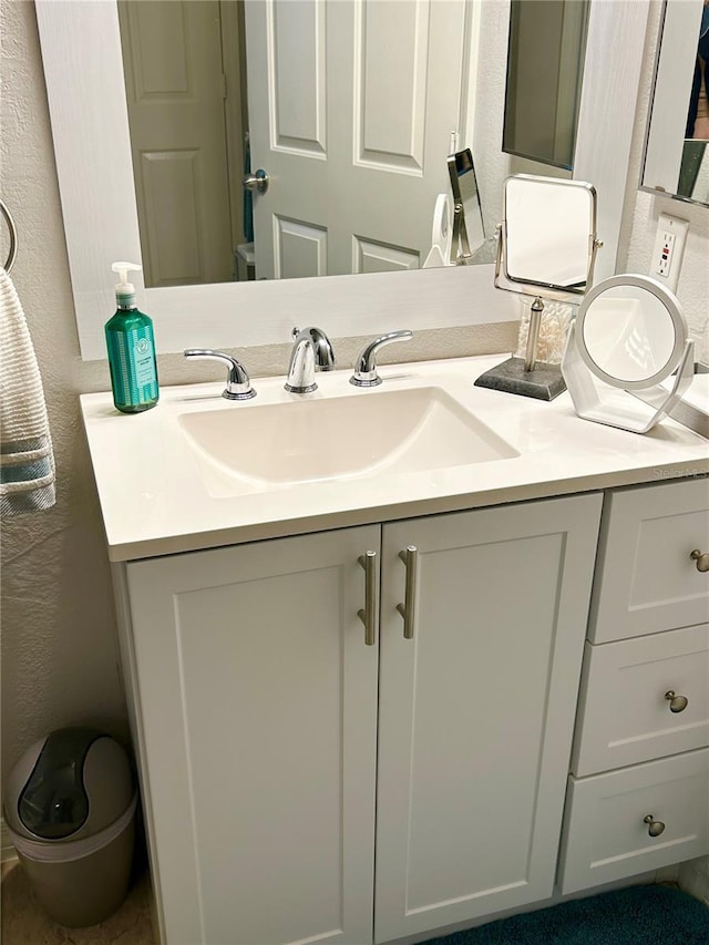 1990 Erving Cir Unit 201, Ocoee, FL 34761 - bathroom featuring vanity and a textured wall