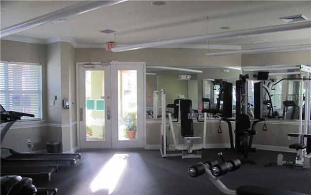 exercise room featuring ornamental molding, french doors, visible vents, and baseboards