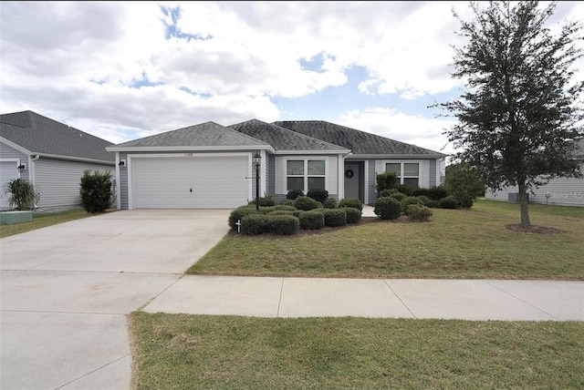 ranch-style house with a garage and a front yard